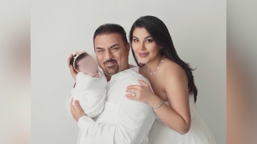 Hamid Mirshojae, 61, is seen with his wife and their baby in a personal photo.