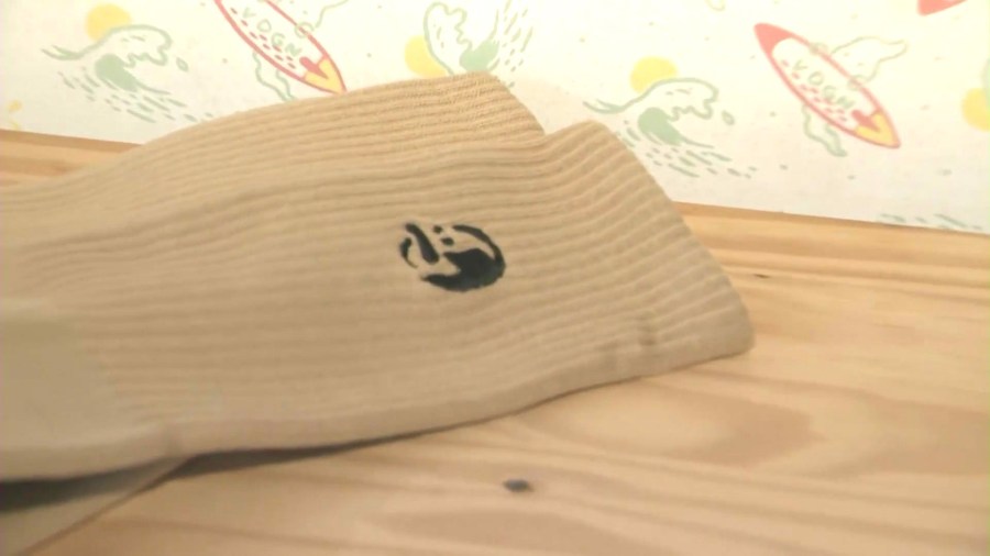 Socks fom Vardagen's new "Wanted" collection featuring a caricature of a male shoplifting suspect that targeted the store. (KTLA)