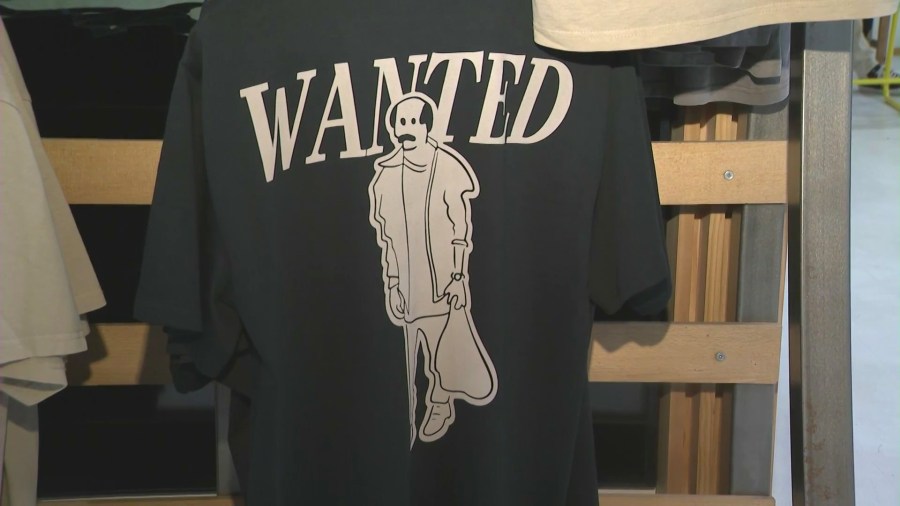 A t-shirt from Vardagen's new "Wanted" collection featuring a caricature of a male shoplifting suspect that targeted their store. (KTLA)