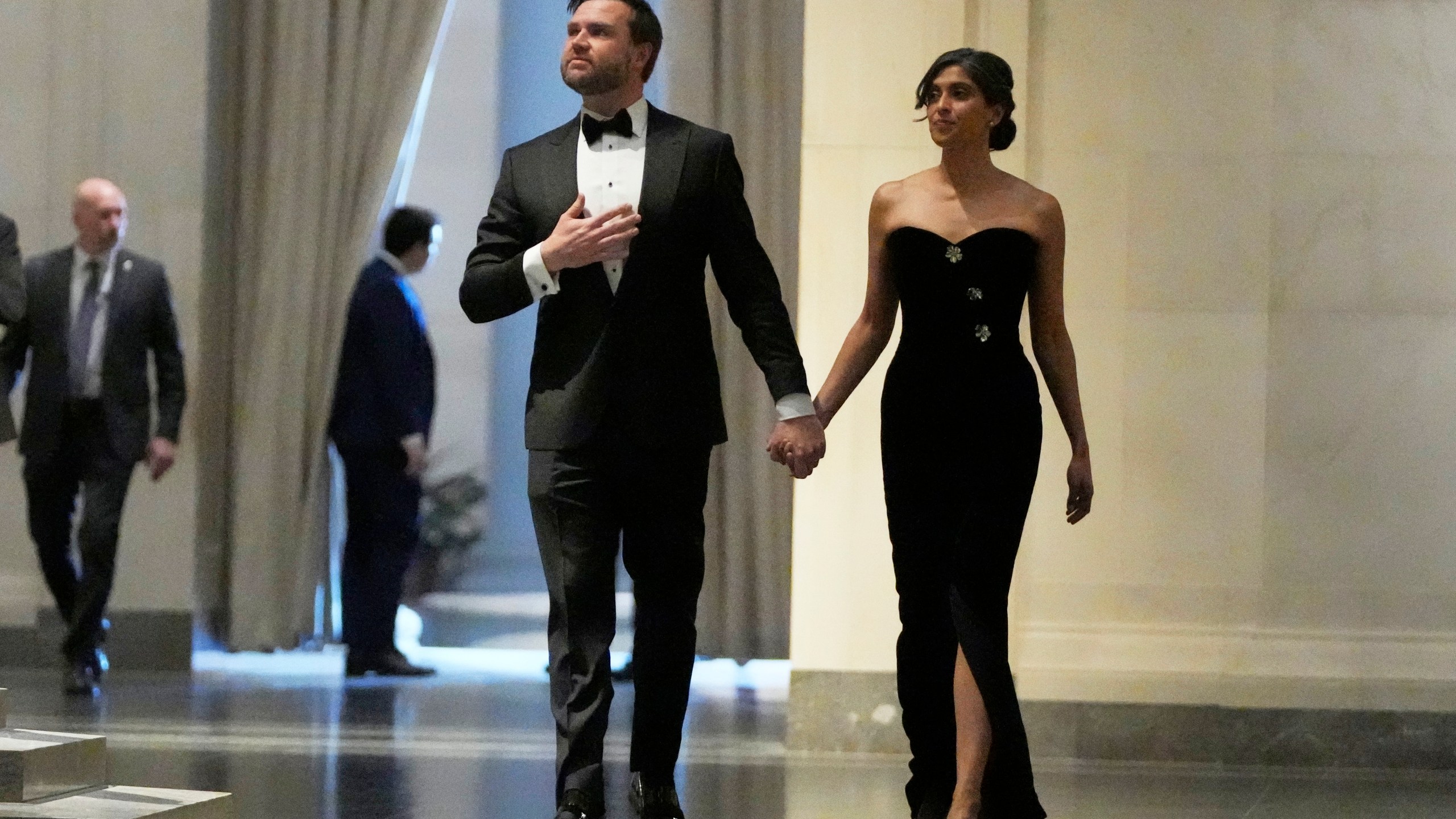Vice President-elect JD Vance, left, and his wife, Usha Vance, arrive to a dinner event at the National Gallery of Art in Washington, Saturday, Jan. 18, 2025. (AP Photo/Mark Schiefelbein)