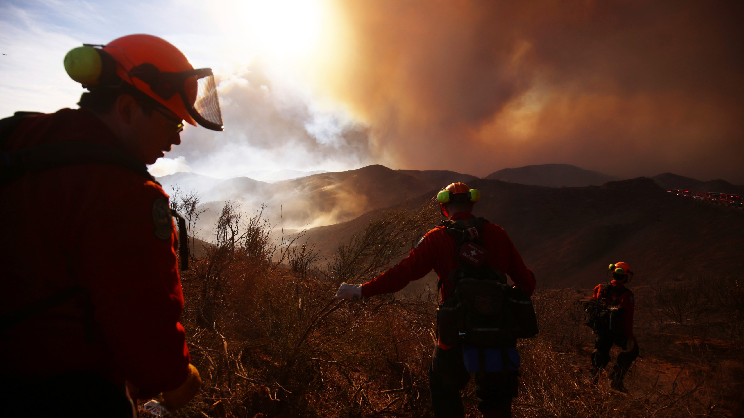 Firefighters work to control the spread of the Hughes Fire in Castaic, Calif., Wednesday, Jan. 22, 2025. (AP Photo/Ethan Swope)