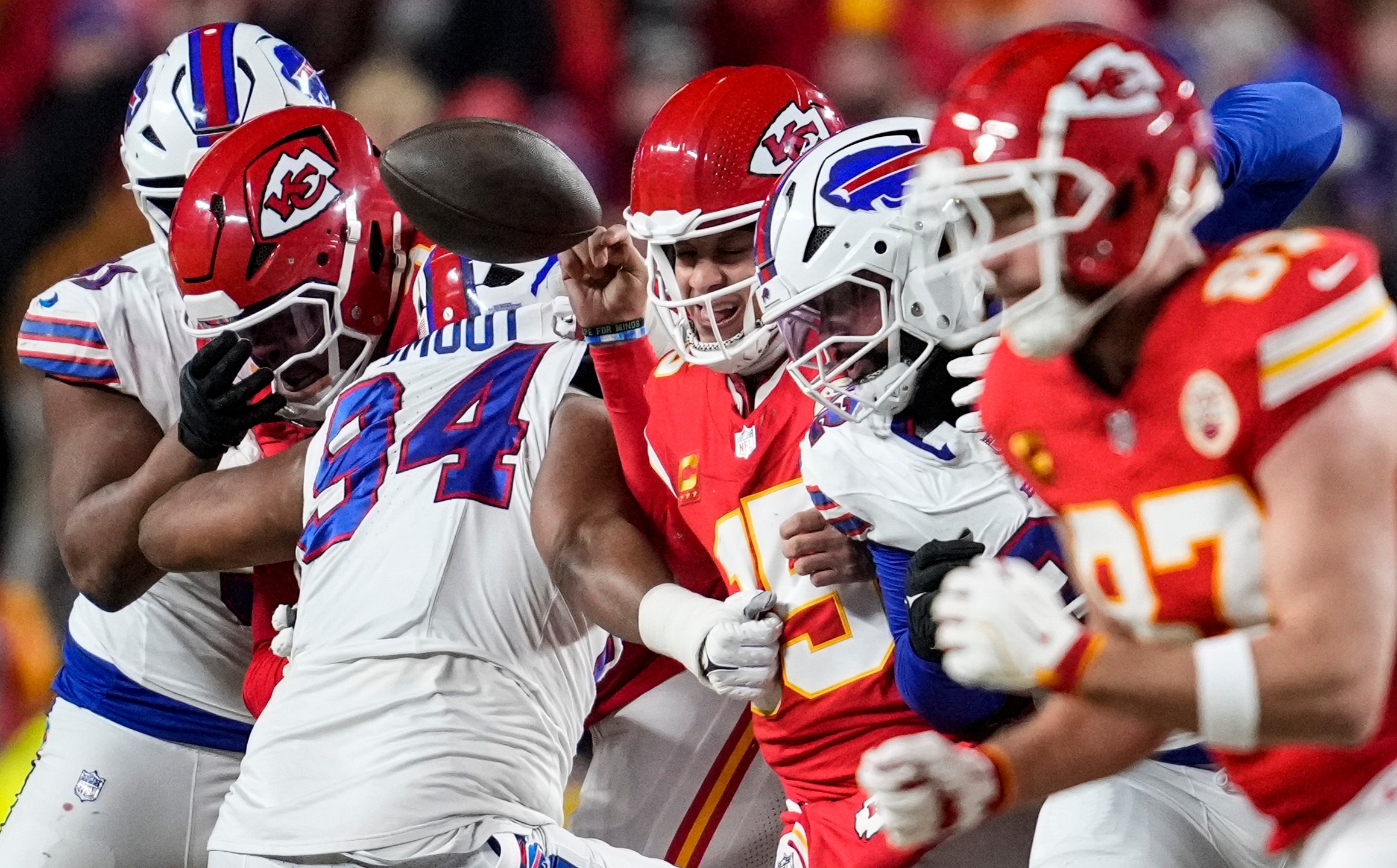 Buffalo Bills defensive end Dawuane Smoot (94) hits Kansas City Chiefs quarterback Patrick Mahomes (15) during the first half of the AFC Championship NFL football game, Sunday, Jan. 26, 2025, in Kansas City, Mo. (AP Photo/Ashley Landis)