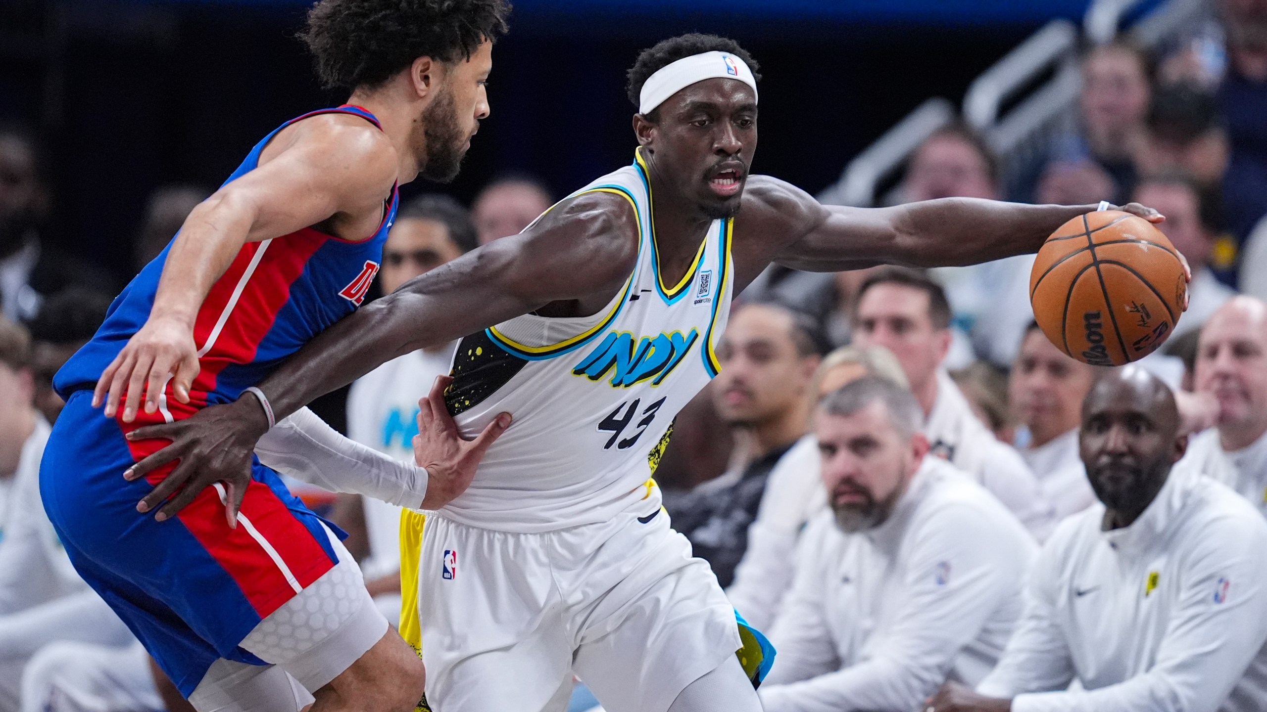 Detroit Pistons guard Cade Cunningham (2) defends Indiana Pacers forward Pascal Siakam (43) during the first half of an NBA basketball game in Indianapolis, Wednesday, Jan. 29, 2025. (AP Photo/Michael Conroy)