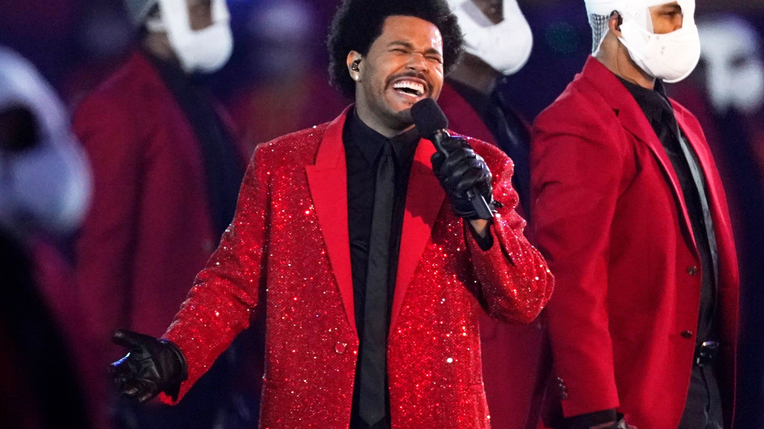 FILE - The Weeknd performs during the halftime show of the NFL Super Bowl 55 football game between the Kansas City Chiefs and Tampa Bay Buccaneers, on Feb. 7, 2021, in Tampa, Fla. (AP Photo/Ashley Landis, File)