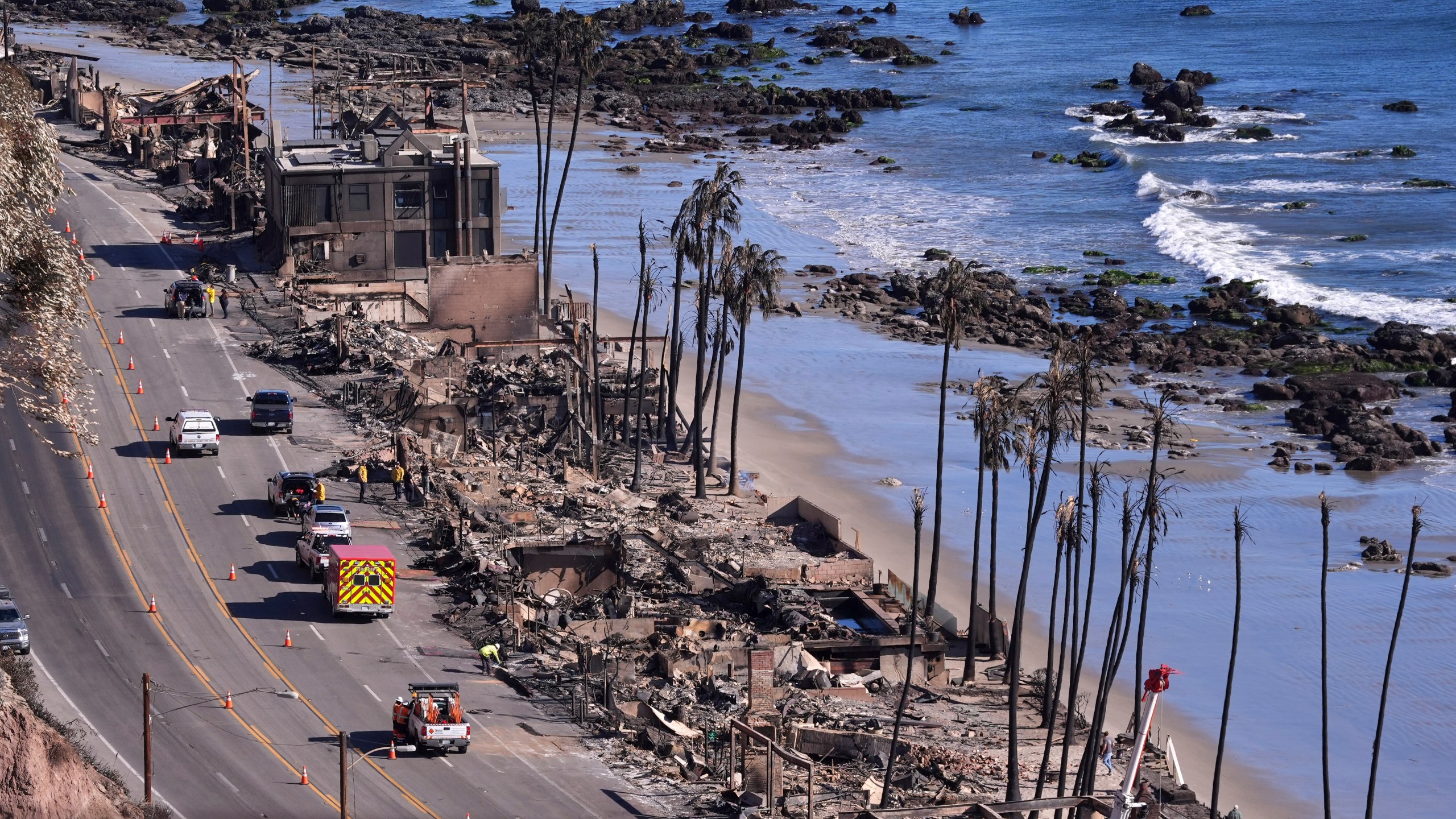 Homes along Pacific Coast Highway are seen burn out from the Palisades Fire, Sunday, Jan. 12, 2025, in Malibu, Calif. (AP Photo/Mark J. Terrill)