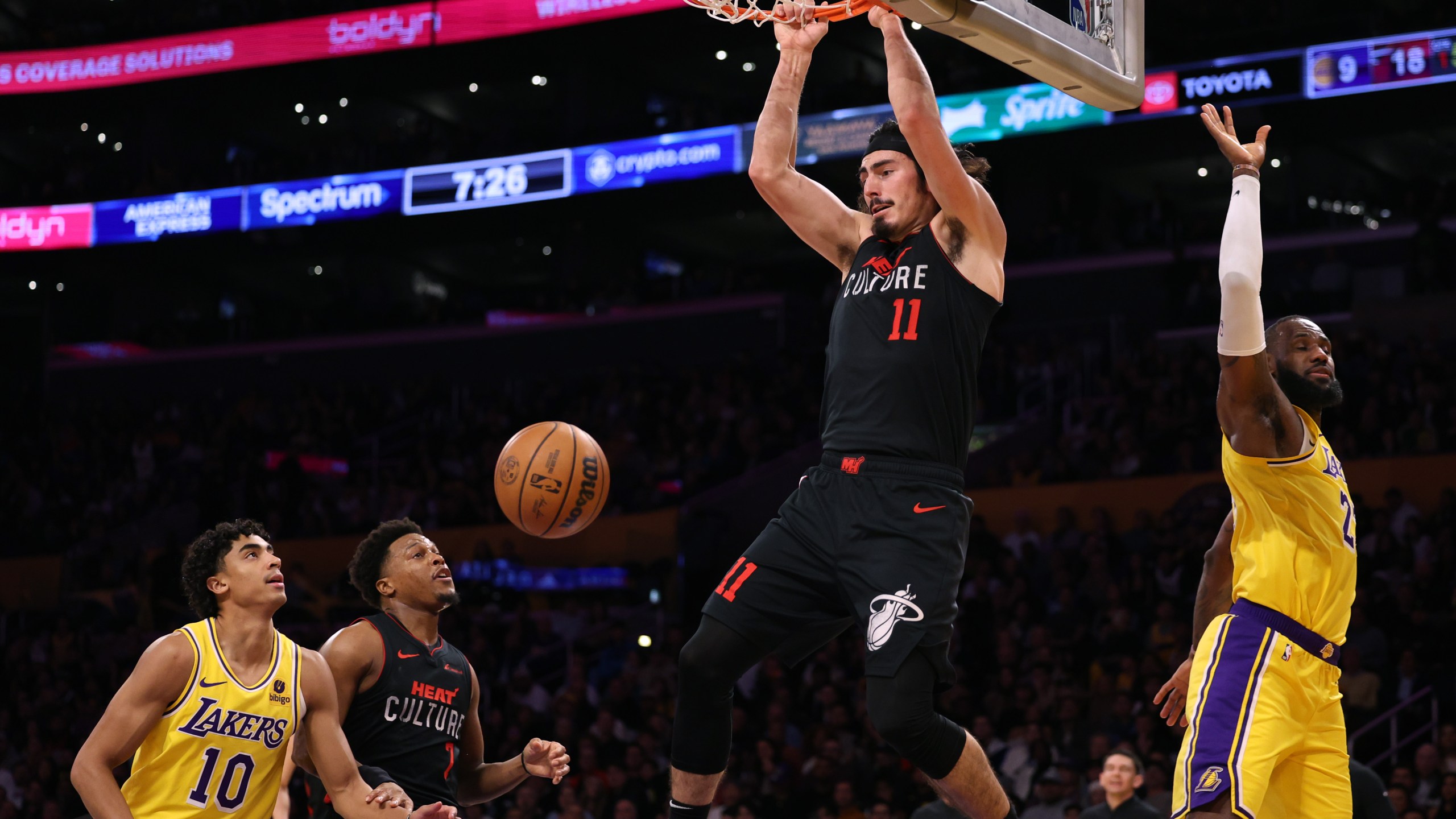Jaime Jaquez Jr. dunks over LeBron James