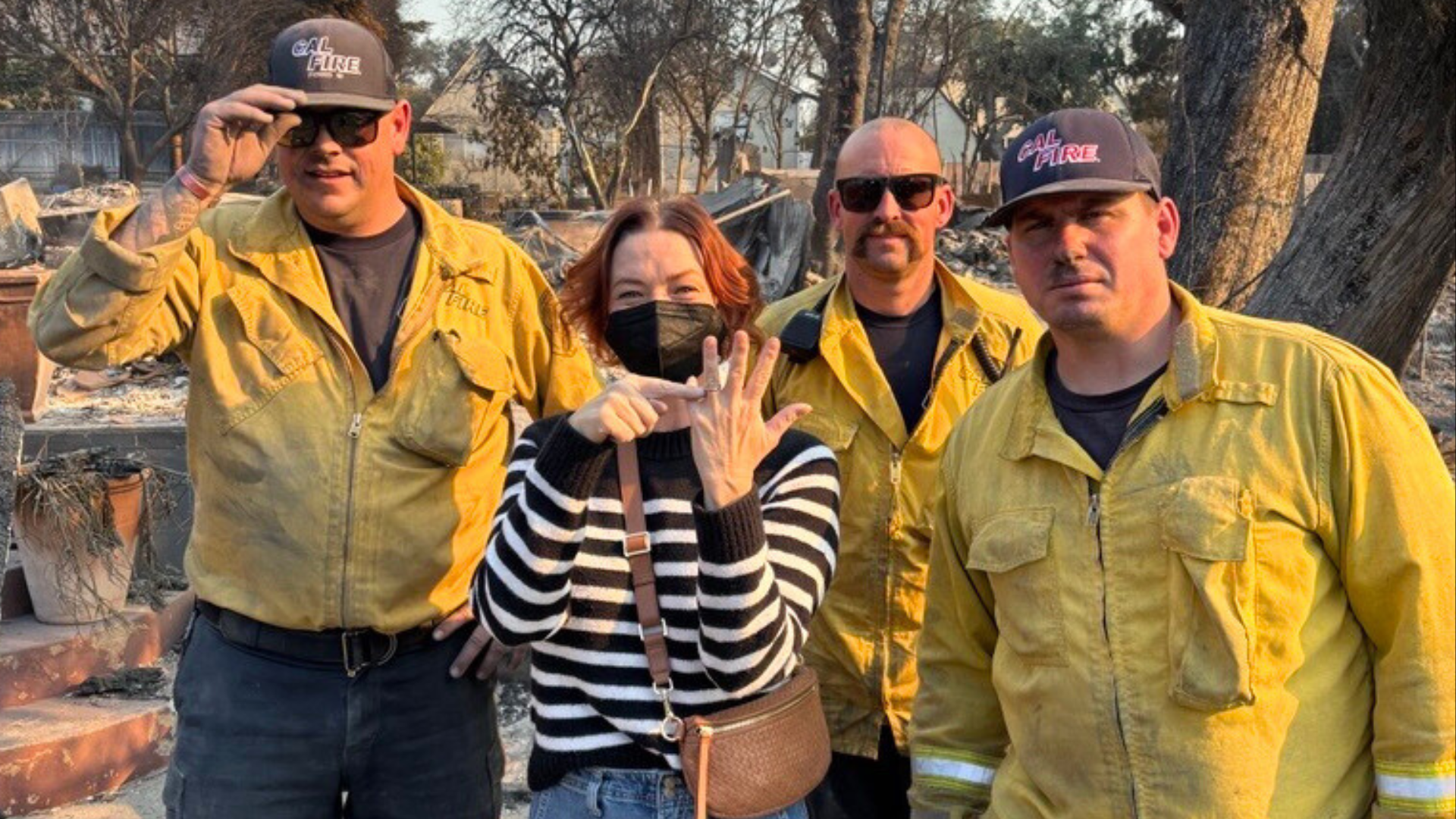 Victoria DeSantis and the firefighters who found her wedding band after the Eaton Fire destroyed her home. (DeSantis Family)