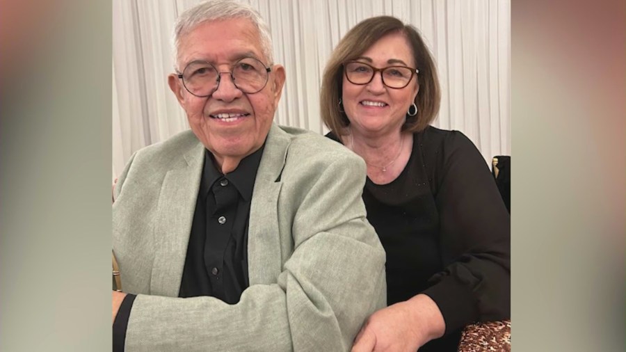 Fritz Mendoza is pictured with his wife in a family photo.