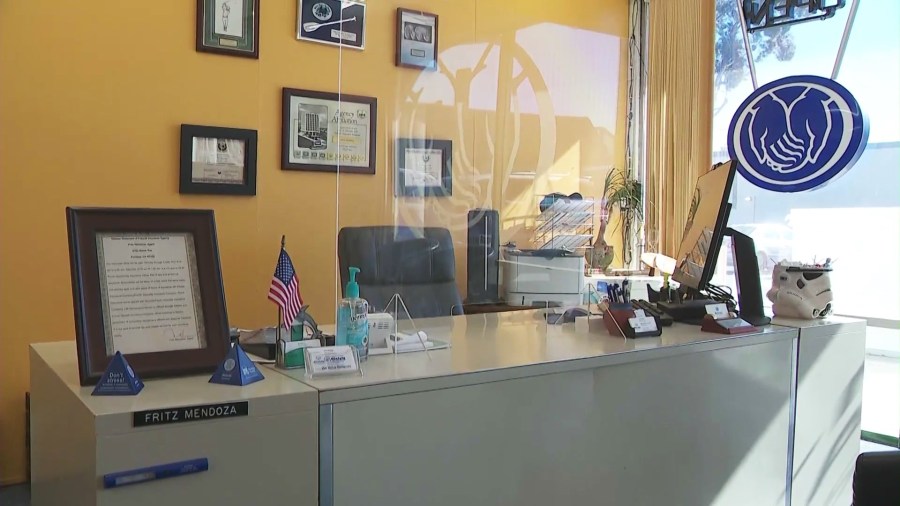 Fritz Mendoza's desk at the Allstate insurance office he operated in Fontana. (KTLA)