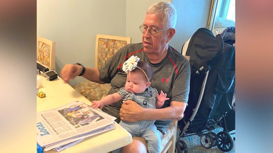 Fritz Mendoza is seen with his granddaughter in a family photo.