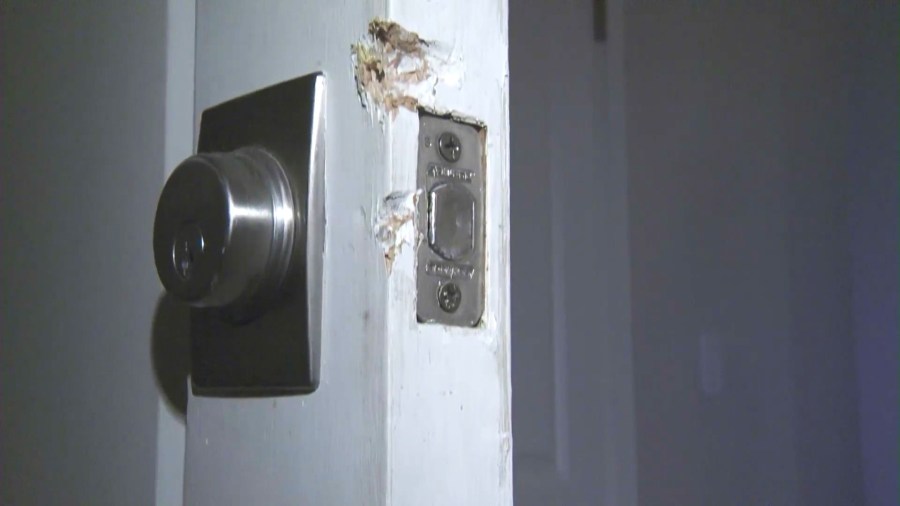 The suspects used a screwdriver and other tools to break the front door of a victim's home. (KTLA)