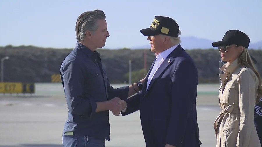 California Gov. Gavin Newsom greets President Donald Trump and First Lady Melania Trump as they arrive at LAX prior to touring the damage left by the Palisades Fire on Jan. 24, 2025. (Pool)