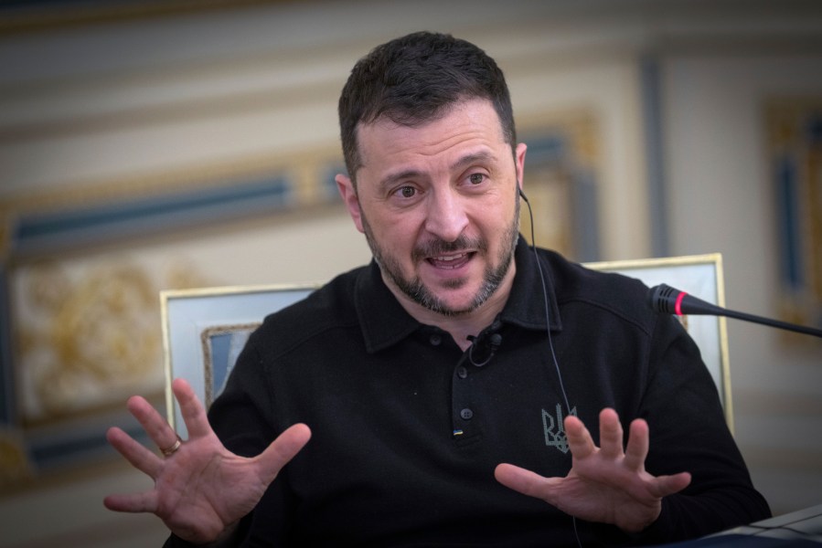 Ukrainian President Volodymyr Zelenskyy gestures as he speaks during an interview with The Associated Press in Kyiv, Ukraine, Saturday, Feb. 1, 2025. (AP Photo/Efrem Lukatsky)