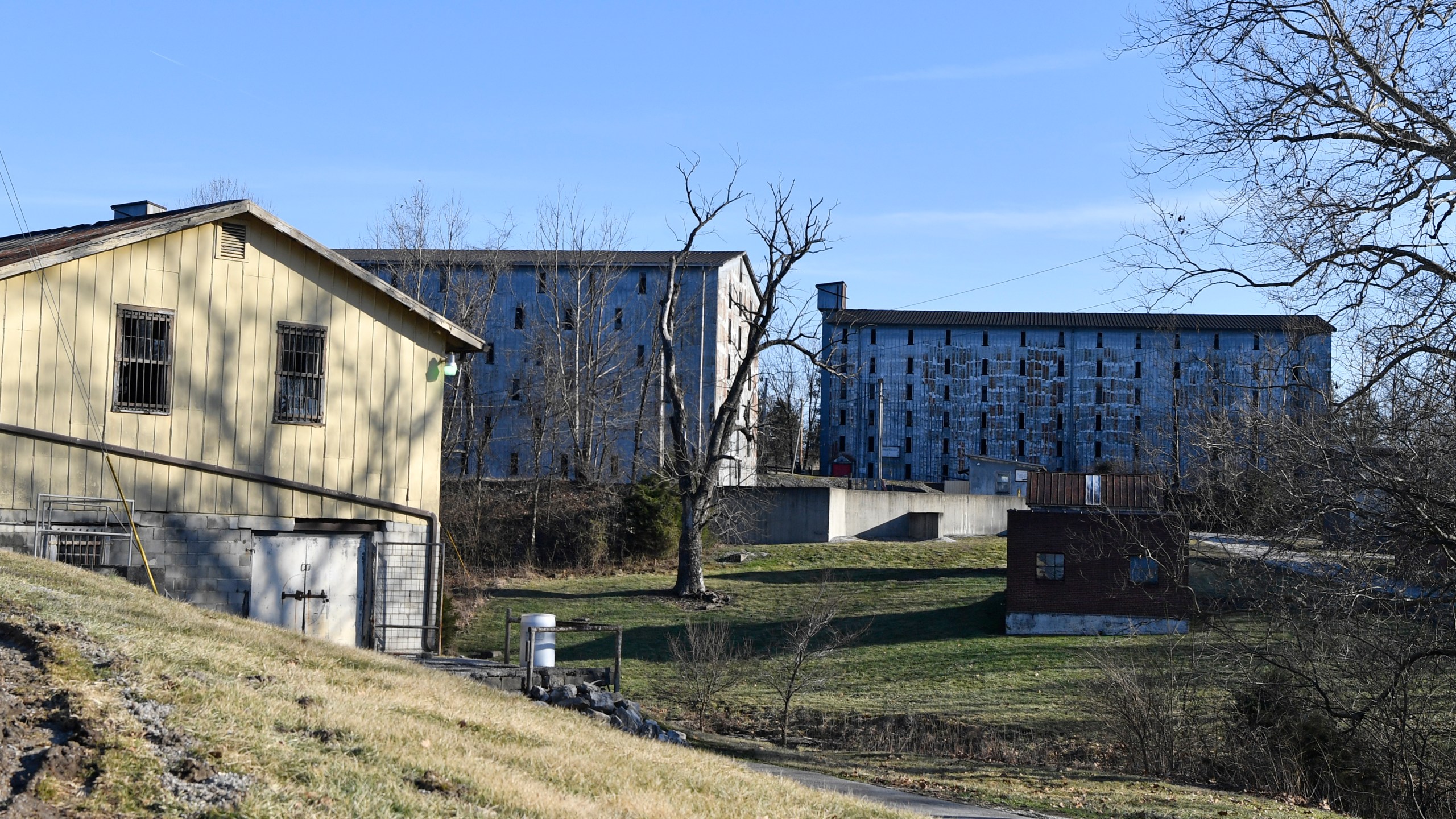 Bourbon barrel rack houses sit on a hillside at the Four Roses Distillery in Lawrenceburg, Ky., Monday, Feb. 3, 2025. (AP Photo/Timothy D. Easley)