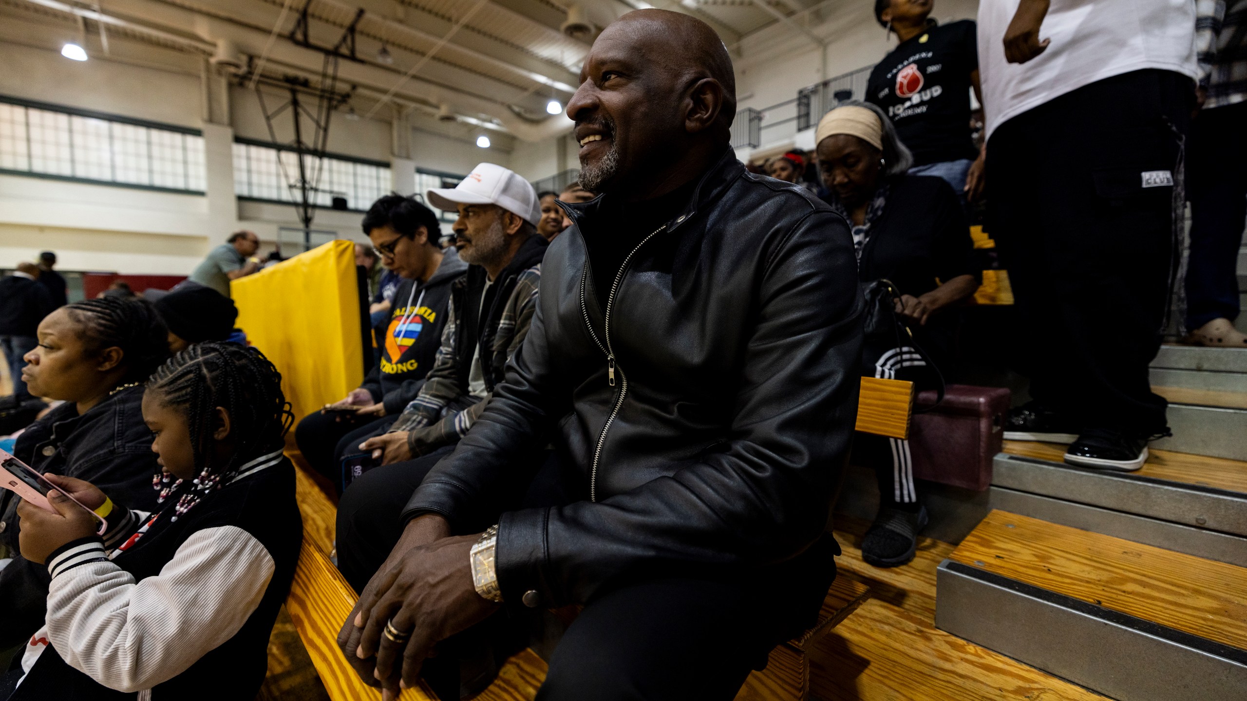 Pastor Charles Johnson attends an event at the gymnasium of Pasadena City College during which The Change Reaction will be handing out about 1,000 checks of between $2,500-$5,000 to people impacted by the Eaton Fire, Tuesday, Jan. 28, 2025 in Pasadena, Calif. (AP Photo/Etienne Laurent)