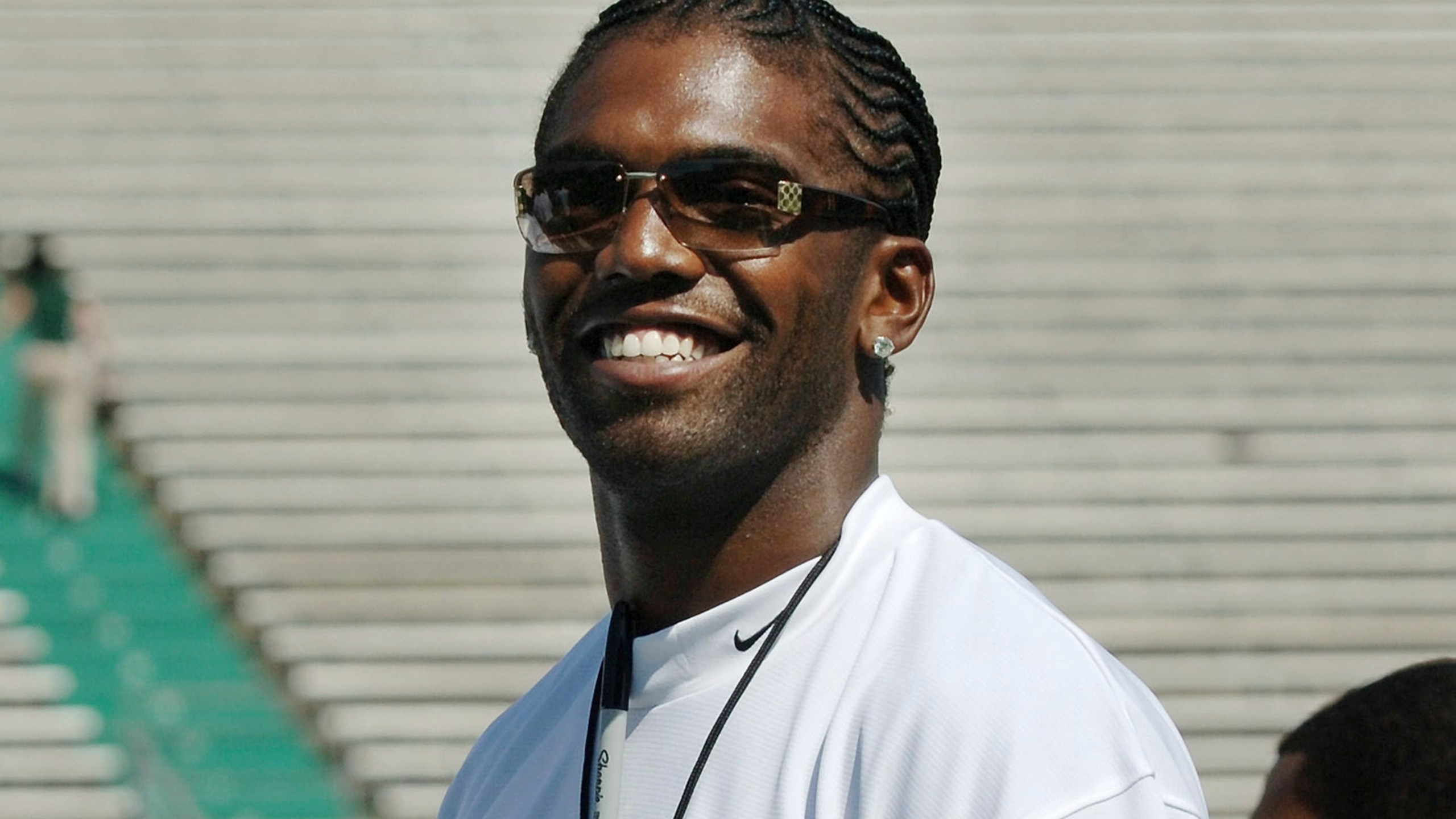 FILE - Former Marshall football player Randy Moss of the Oakland Raiders waves to fans prior to serving as an honorary coach during Marshall's annual Green-White game Saturday, April 22, 2006, in Huntington, W.Va. (AP Photo/Jeff Gentner, File)