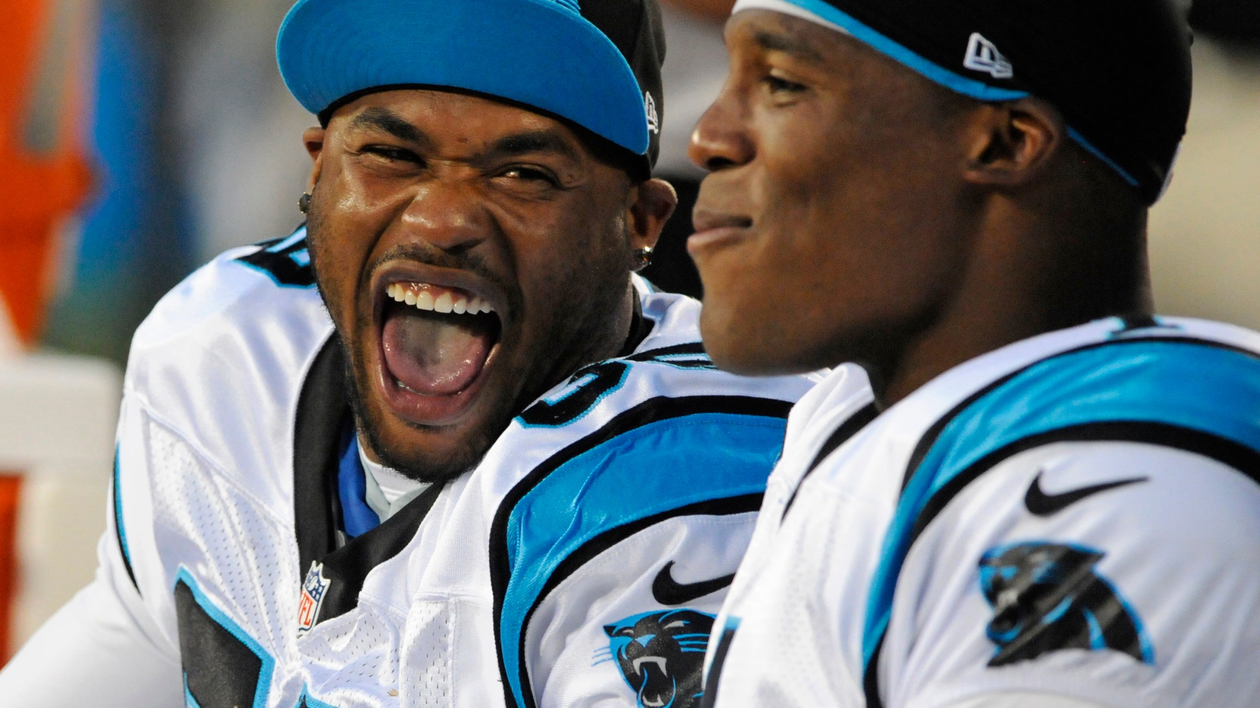 FILE - Carolina Panthers' Steve Smith, left, and Cam Newton, right, share a laugh during the first half of an NFL preseason football game against the Pittsburgh Steelers, Thursday, Aug. 29, 2013, in Charlotte, N.C. (AP Photo/Mike McCarn, File)