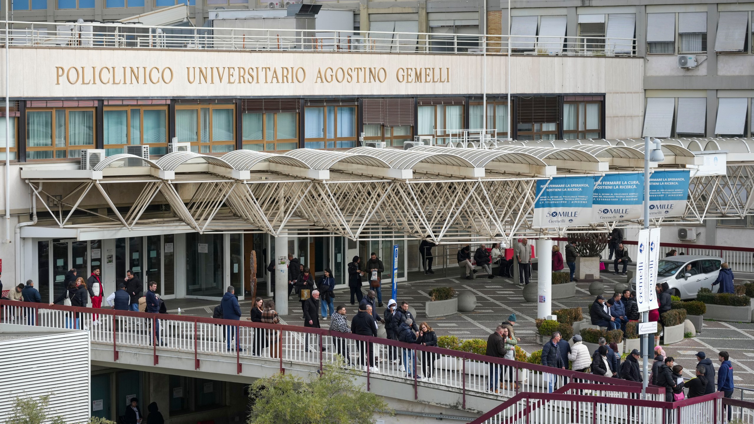 A view of the main entrance of the Agostino Gemelli Polyclinic, in Rome, Monday, Feb. 17, 2025, where Pope Francis has been hospitalized to undergo some necessary diagnostic tests and to continue his ongoing treatment for bronchitis. (AP Photo/Andrew Medichini)