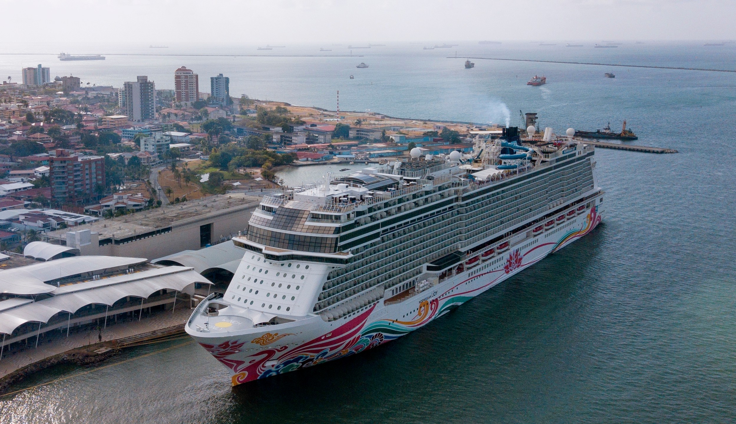 FILE - Bahamas flagged cruise ship Norwegian Joy stands at anchorage before its departure from the Colon 2000 port at Manzanillo Bay in Colon, Panama, Thursday, April 20, 2023. (AP Photo/Arnulfo Franco, File)
