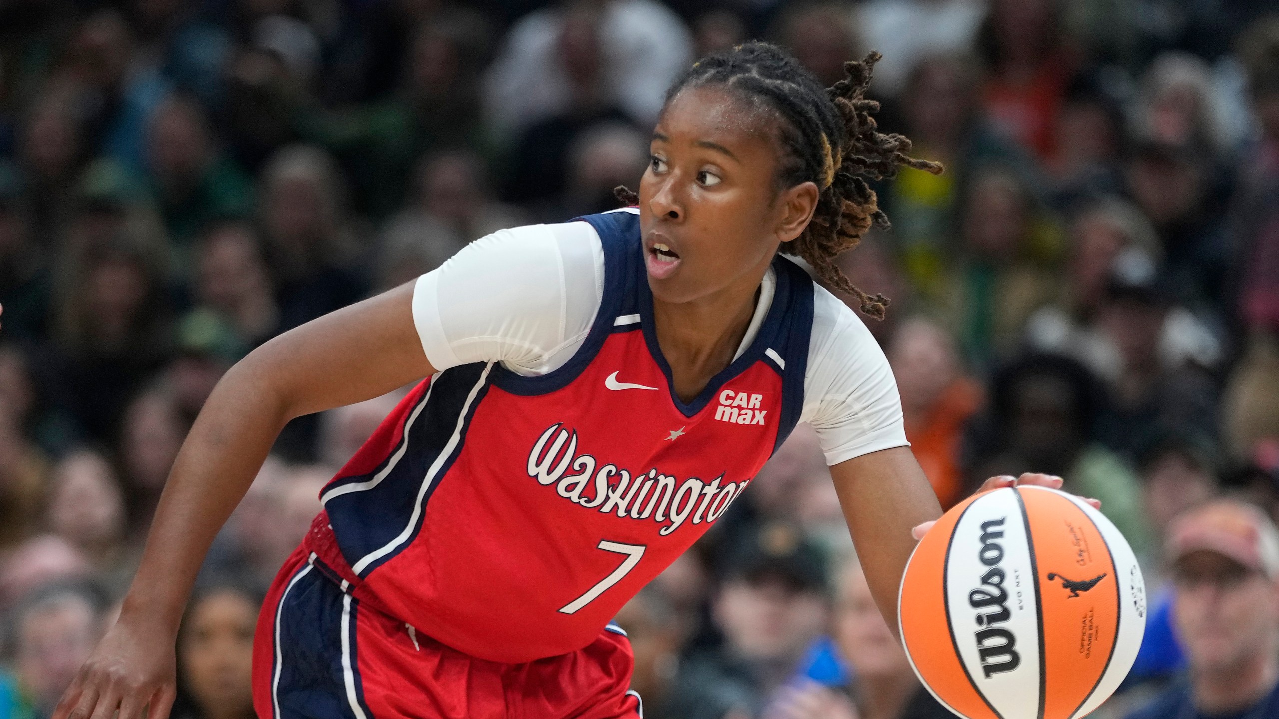FILE - Washington Mystics guard Ariel Atkins (7) moves the ball against the Seattle Storm during a WNBA basketball game May 25, 2024, in Seattle. (AP Photo/Lindsey Wasson, File)