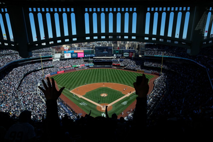 FILE - Fans react after New York Yankees' Aaron Judge hits a home run during the third inning of a baseball game against the San Francisco Giants at Yankee Stadium, April 2, 2023, in New York. (AP Photo/Seth Wenig, File)