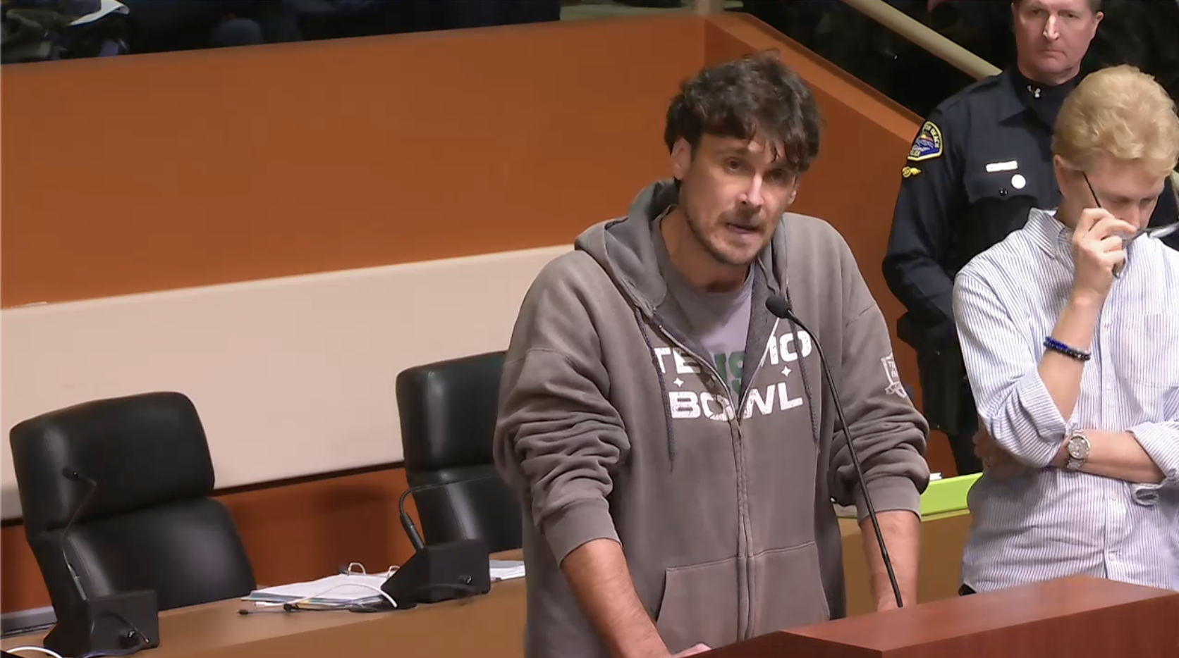 Chris Kluwe, former NFL punter, speaks in opposition to a MAGA-inspired plaque design at Huntington Beach City Council meeting moments before being detained by police on Feb. 18, 2025.