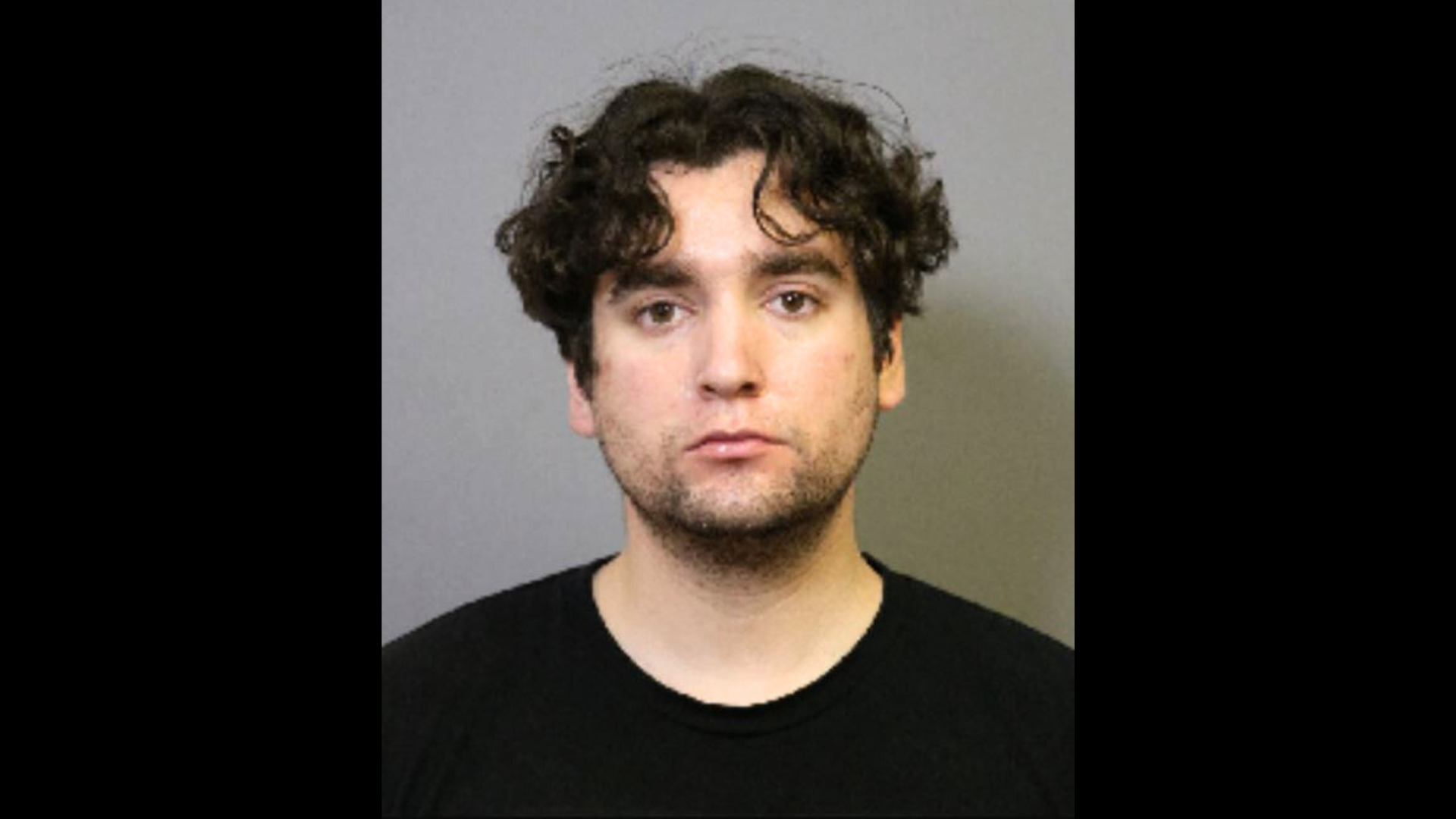 Peter Michael Mejia, 27, is seen in a booking photo from the Costa Mesa Police Department.