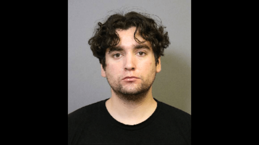 Peter Michael Mejia, 27, is seen in a booking photo from the Costa Mesa Police Department.