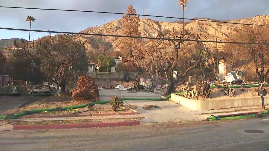 Crews work on debris removal and preparations for Altadena and Eaton fire burn scar areas ahead of an incoming storm on Feb. 11, 2025. (KTLA)
