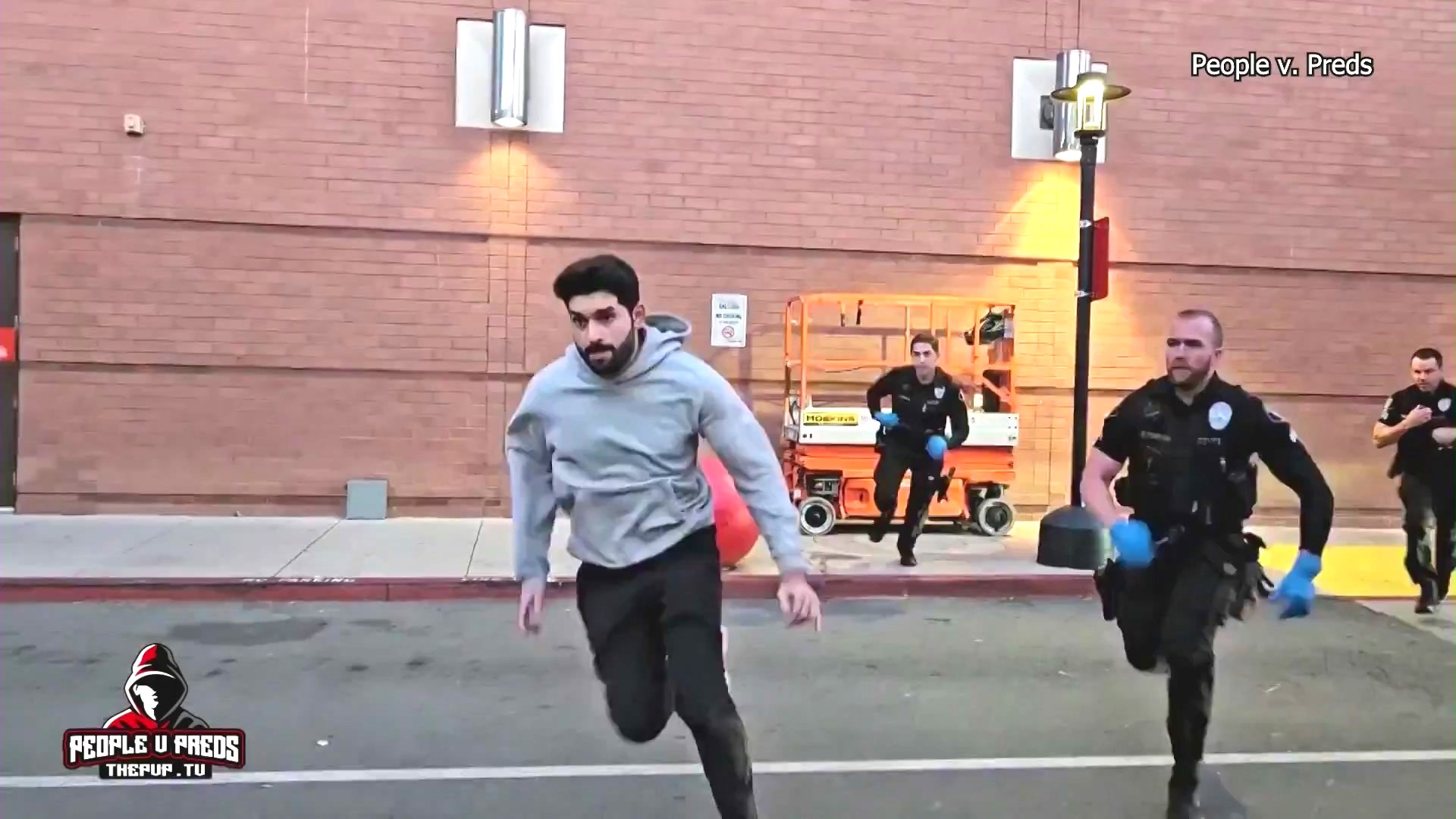 The suspect, Ryan Abdelrahim, 23, is seen running from police officers during a child predator sting operation at the Glendale Galleria on Feb. 19, 2025. (People vs. Preds)