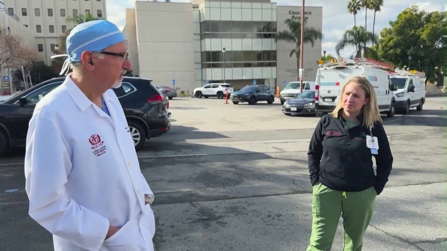 Dr. Anees Razzouk, a heart surgeon (left), and Dr. Natalie Shwaish, a pediatric cardiologist, speak to KTLA about the historic pediatric partial heart transplant surgery they worked on at Loma Linda Children’s Hospital in Loma, Linda, California. (KTLA)