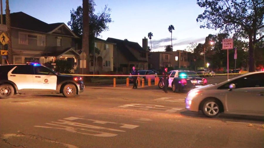 Police investigate a silver sedan with bullet holes after three people, including an infant, were hospitalized in a drive-by shooting in South L.A. on Feb. 8, 2025. (KTLA)
