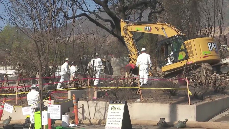 Crews work on debris removal and preparations for Altadena and Eaton fire burn scar areas ahead of an incoming storm on Feb. 11, 2025. (KTLA)