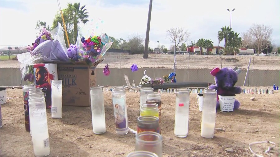 Loved ones created a makeshift memorial to honor Asia Guercy near the flood channel where she and Charles Dark, 31, were killed. (KTLA)