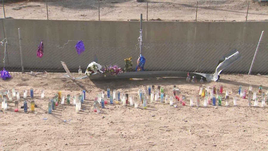 Loved ones created a makeshift memorial to honor Asia Guercy near the flood channel where she and Charles Dark, 31, were killed. (KTLA)