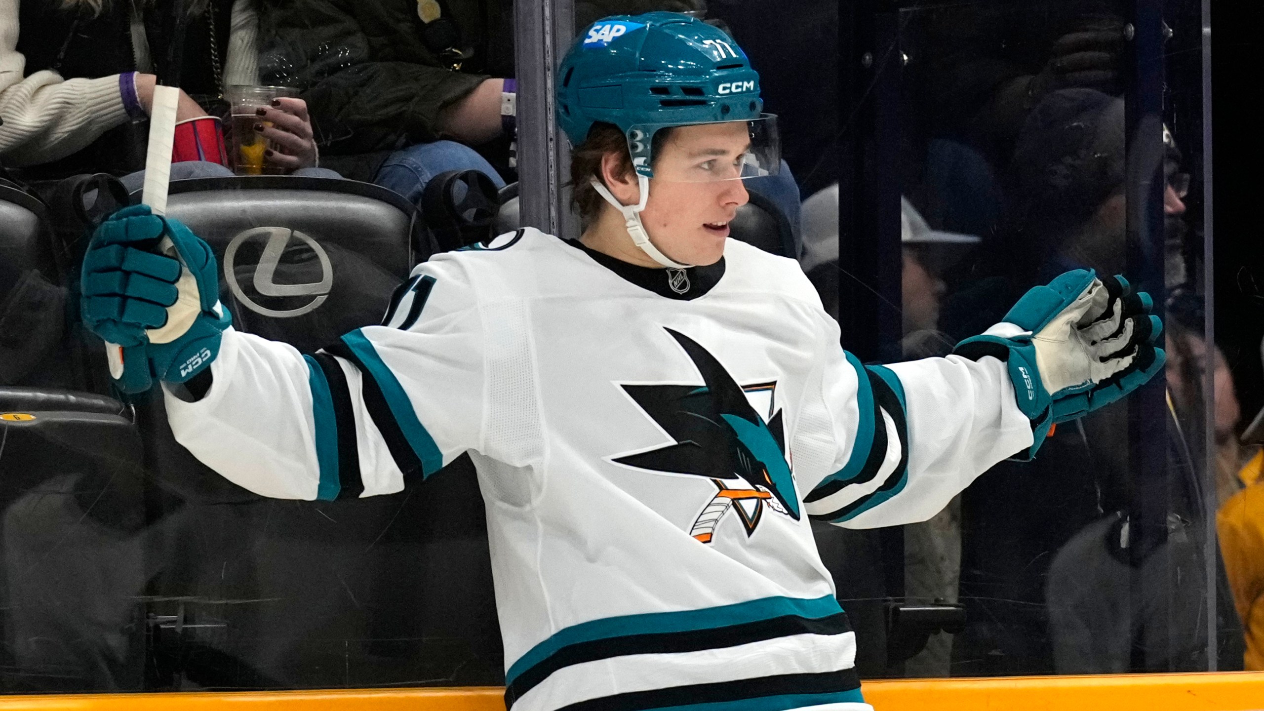 FILE- San Jose Sharks center Macklin Celebrini celebrates after scoring a goal against the Nashville Predators during the first period of an NHL hockey game, Tuesday, Jan. 21, 2025, in Nashville, Tenn. (AP Photo/Mark Humphrey, File)