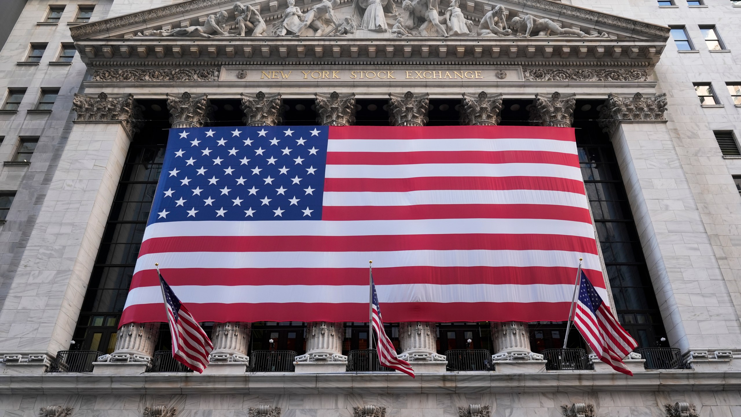 FILE - An American flag is displayed on the New York Stock Exchange in New York, Monday, Feb. 24, 2025. (AP Photo/Seth Wenig, File)