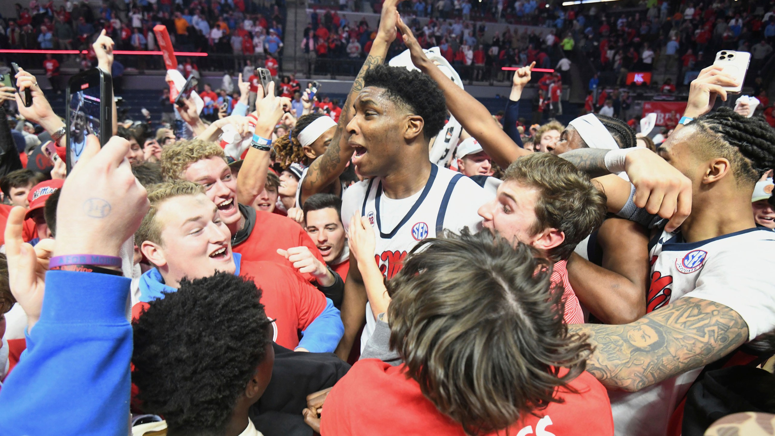 Mississippi forward Malik Dia (0), center, celebrates a win over Tennessee following an NCAA college basketball game in Oxford, Miss., Wednesday, March 5, 2025. (AP Photo/Bruce Newman)
