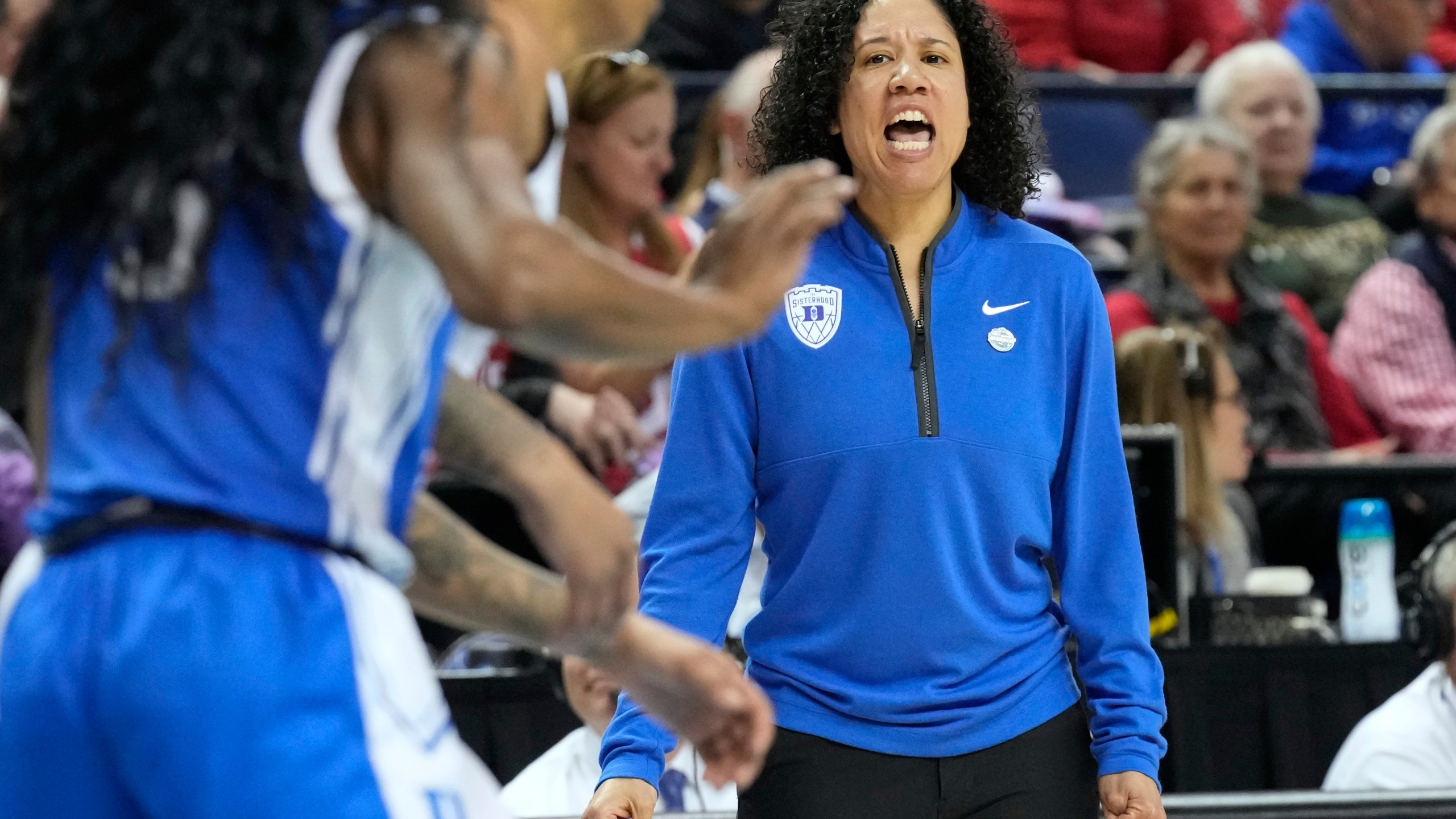 Duke head coach Kara Lawson directs her team against NC State during an NCAA college basketball game in the championship of the Atlantic Coast Conference tournament Greensboro, N.C., Sunday, March 9, 2025. (AP Photo/Chuck Burton)