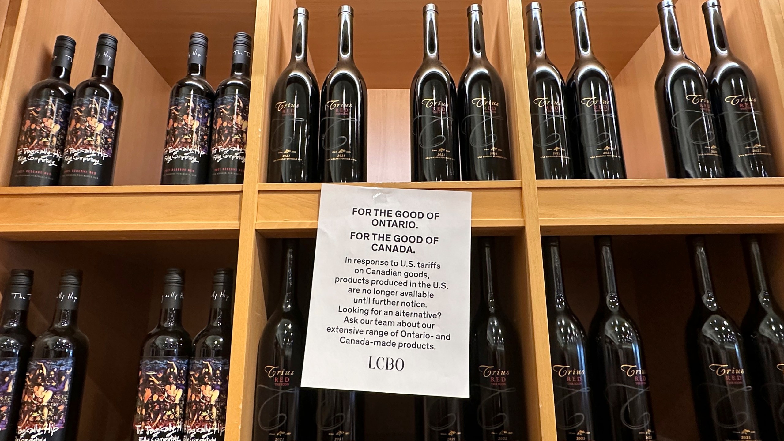A sign is posted on a wine shelves at an LCBO, the government-run liquor stores where most wine and spirits in the province are purchased, Sunday, March 9, 2025, in Toronto. (AP Photo/Jill Colvin)
