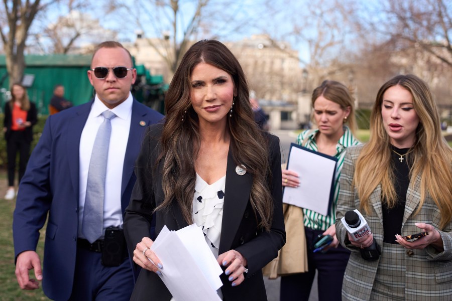 Homeland Security Secretary Kristi Noem walks past journalists at the White House, Monday, March 10, 2025, in Washington. (AP Photo/Alex Brandon)