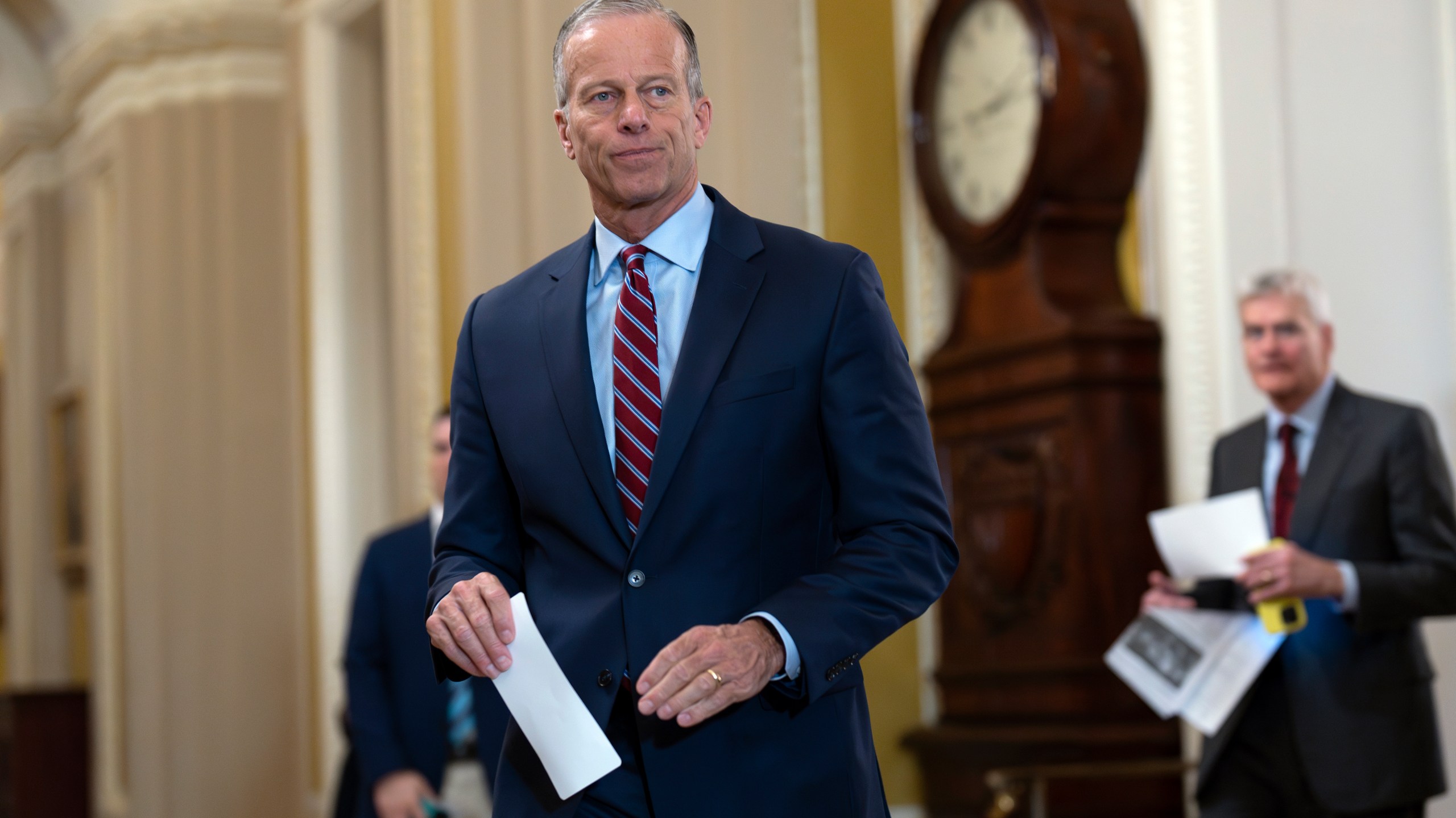 Senate Majority Leader John Thune, R-S.D., arrives to speak to reporters as Republicans work to pass an interim spending bill that would avoid a partial government shutdown and keep federal agencies funded through September, at the Capitol in Washington, Tuesday, March 11, 2025. (AP Photo/J. Scott Applewhite)