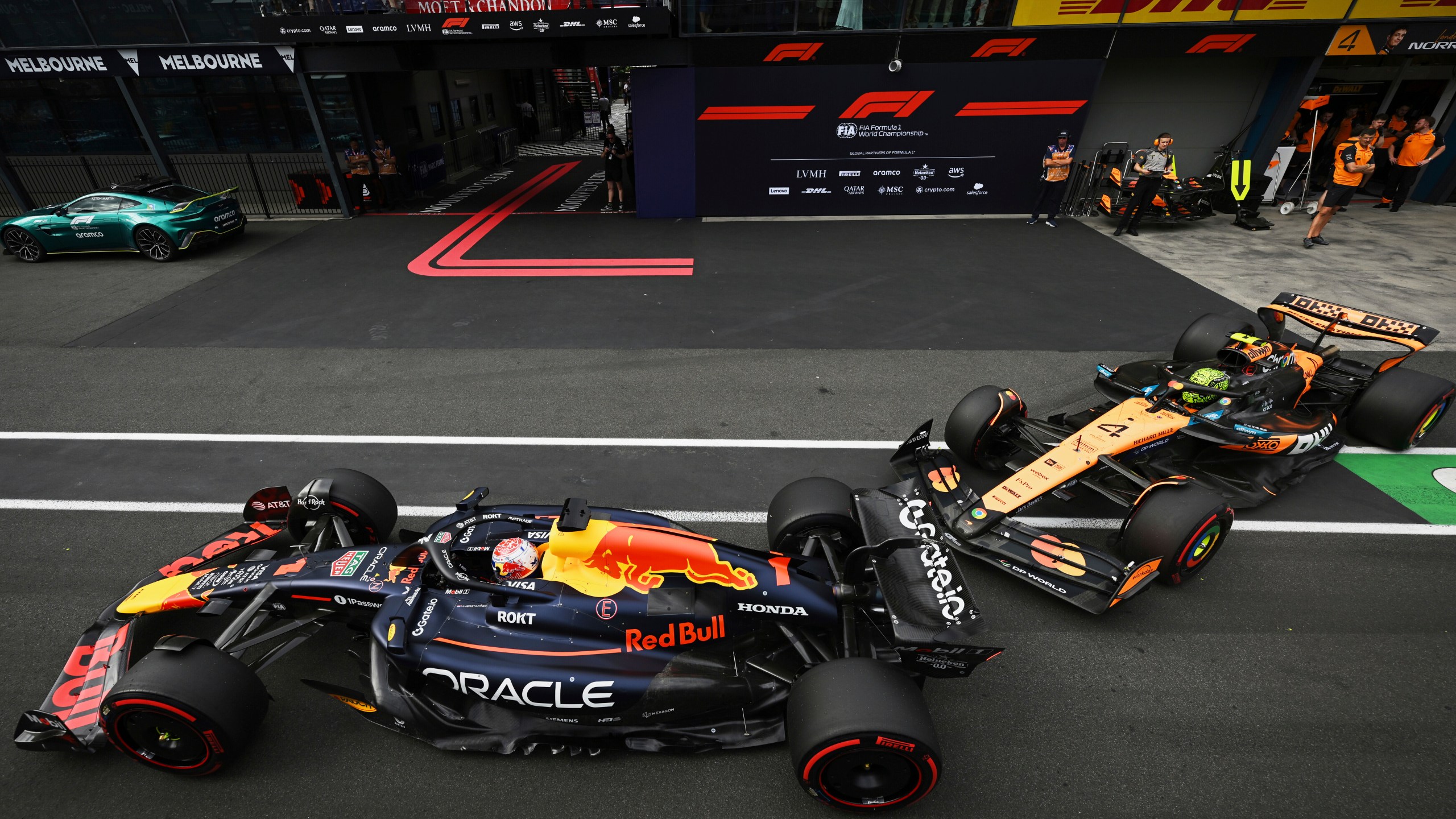 McLaren driver Lando Norris of Britain follows Red Bull driver Max Verstappen of the Netherlands down pit lane during qualifying at the Australian Formula One Grand Prix at Albert Park, in Melbourne, Australia, Saturday, March 15, 2025. (Tracey Nearmy/Pool Photo via AP)