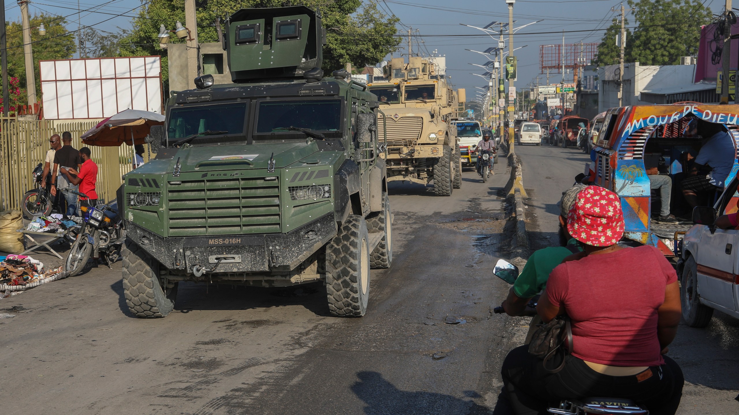 Kenyan police patrol in vehicles through Delmas in Port-au-Prince, Haiti, Friday, March 14, 2025.(AP Photo/Odelyn Joseph)