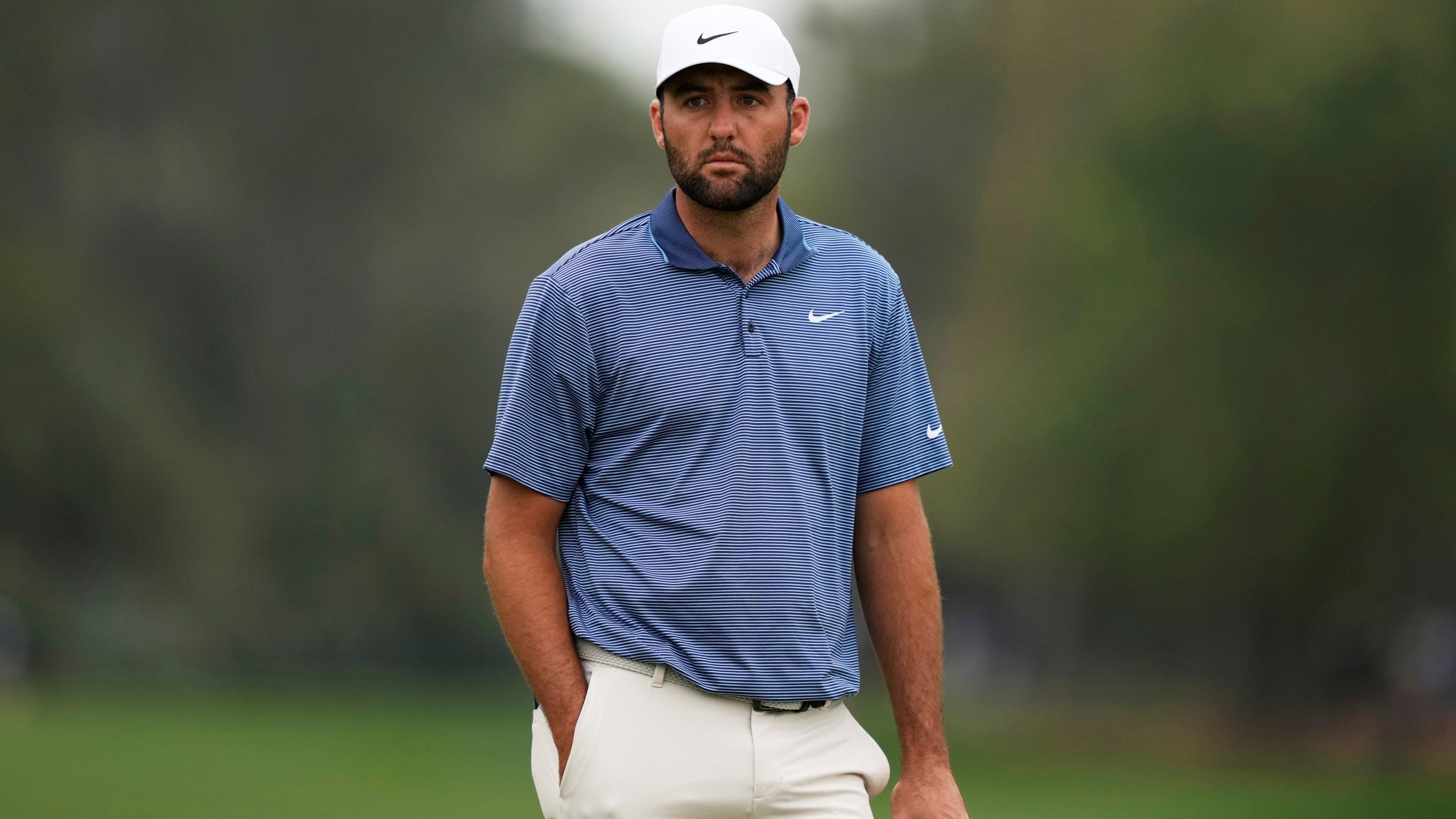 Scottie Scheffler waits for his turn on the second hole during the final round of The Players Championship golf tournament Sunday, March 16, 2025, in Ponte Vedra Beach, Fla. (AP Photo/Julia Demaree Nikhinson)