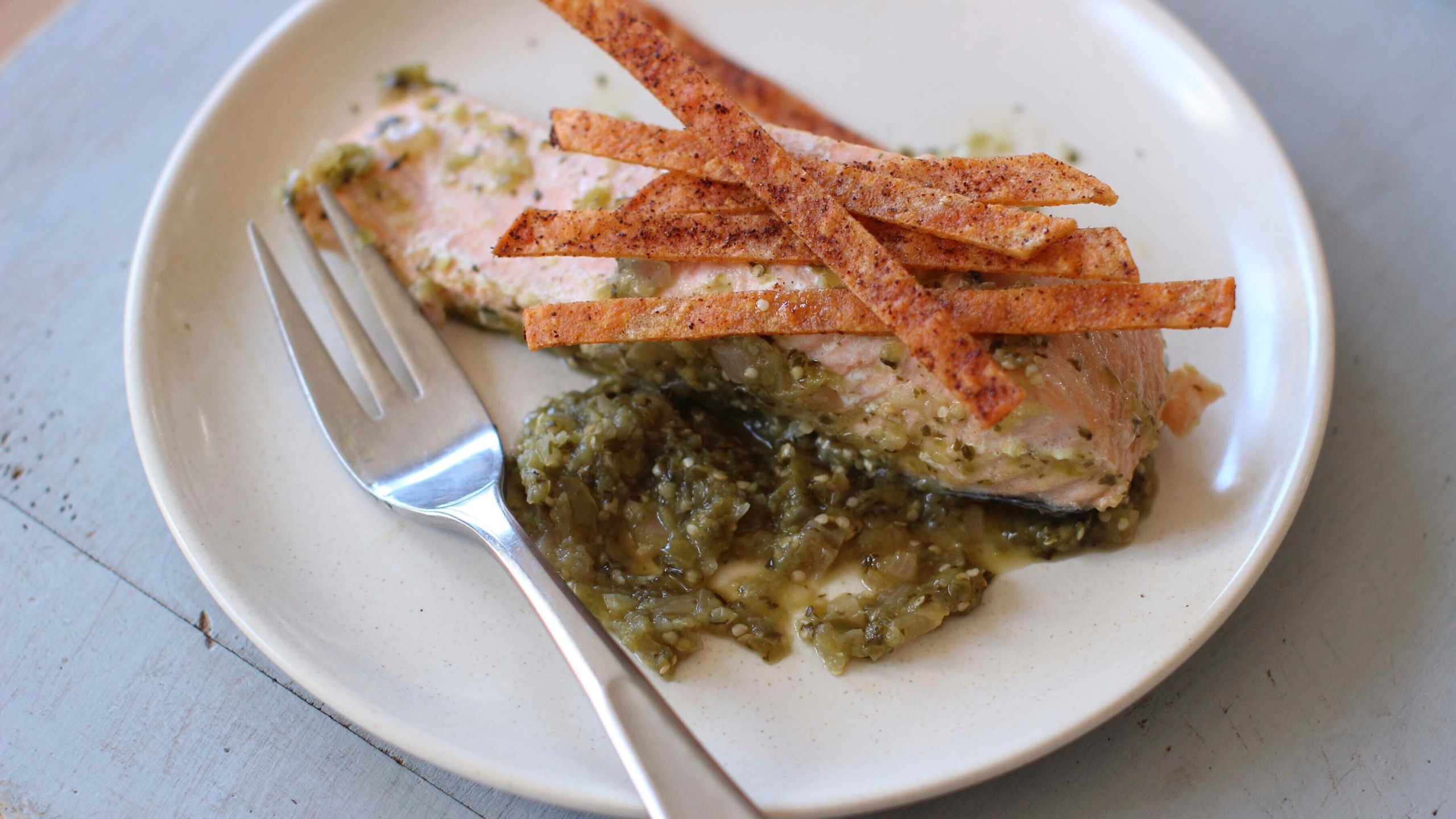 FILE - Salmon poached in green salsa and topped with baked chips are displayed for a photo in Concord, N.H. (AP Photo/Matthew Mead, File)