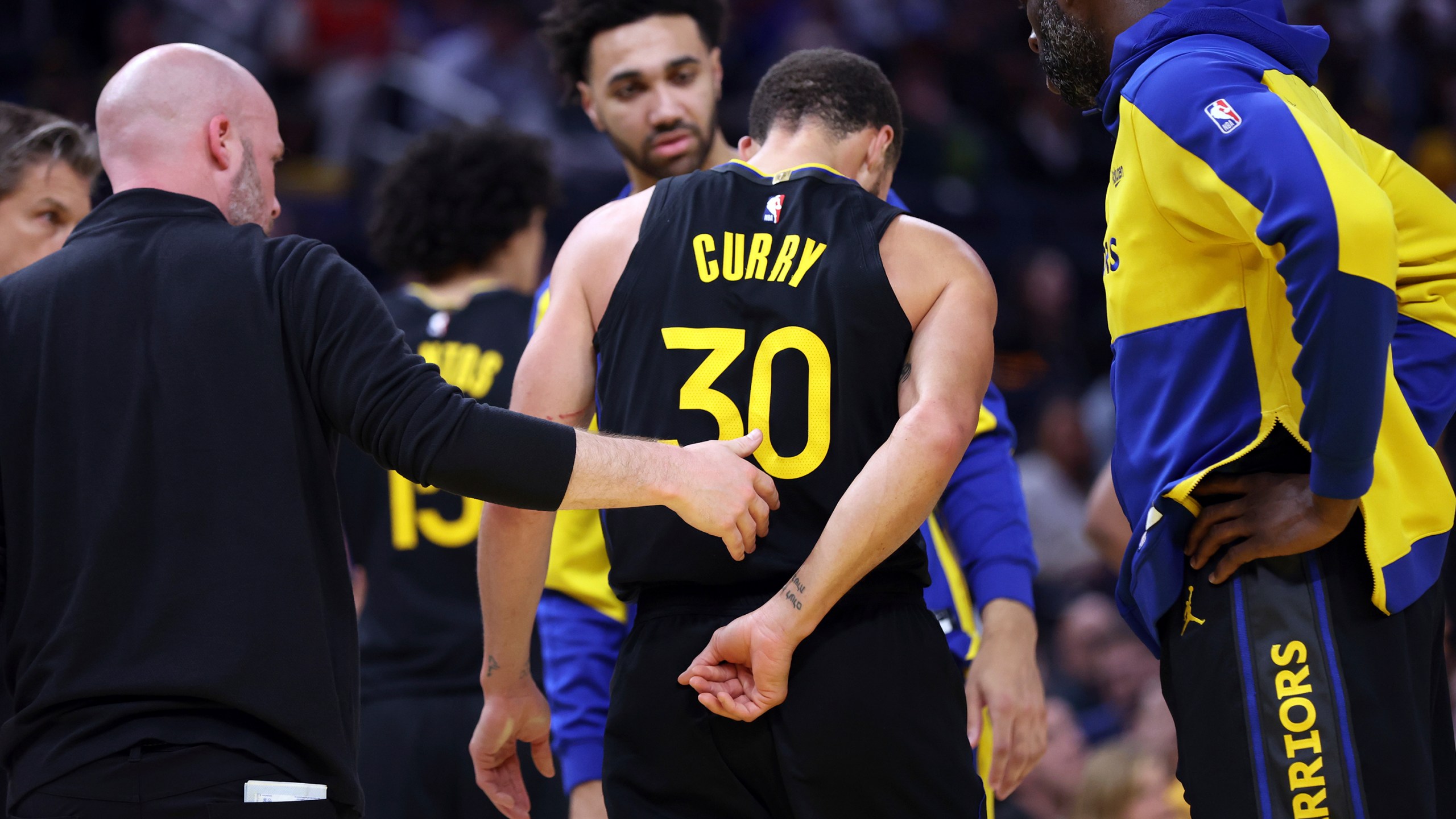 Golden State Warriors' Stephen Curry walks off the court after injuring himself in 3rd quarter against Toronto Raptors during NBA game at Chase Center in San Francisco on Thursday, March 20, 2025. (Scott Strazzante/San Francisco Chronicle via AP)
