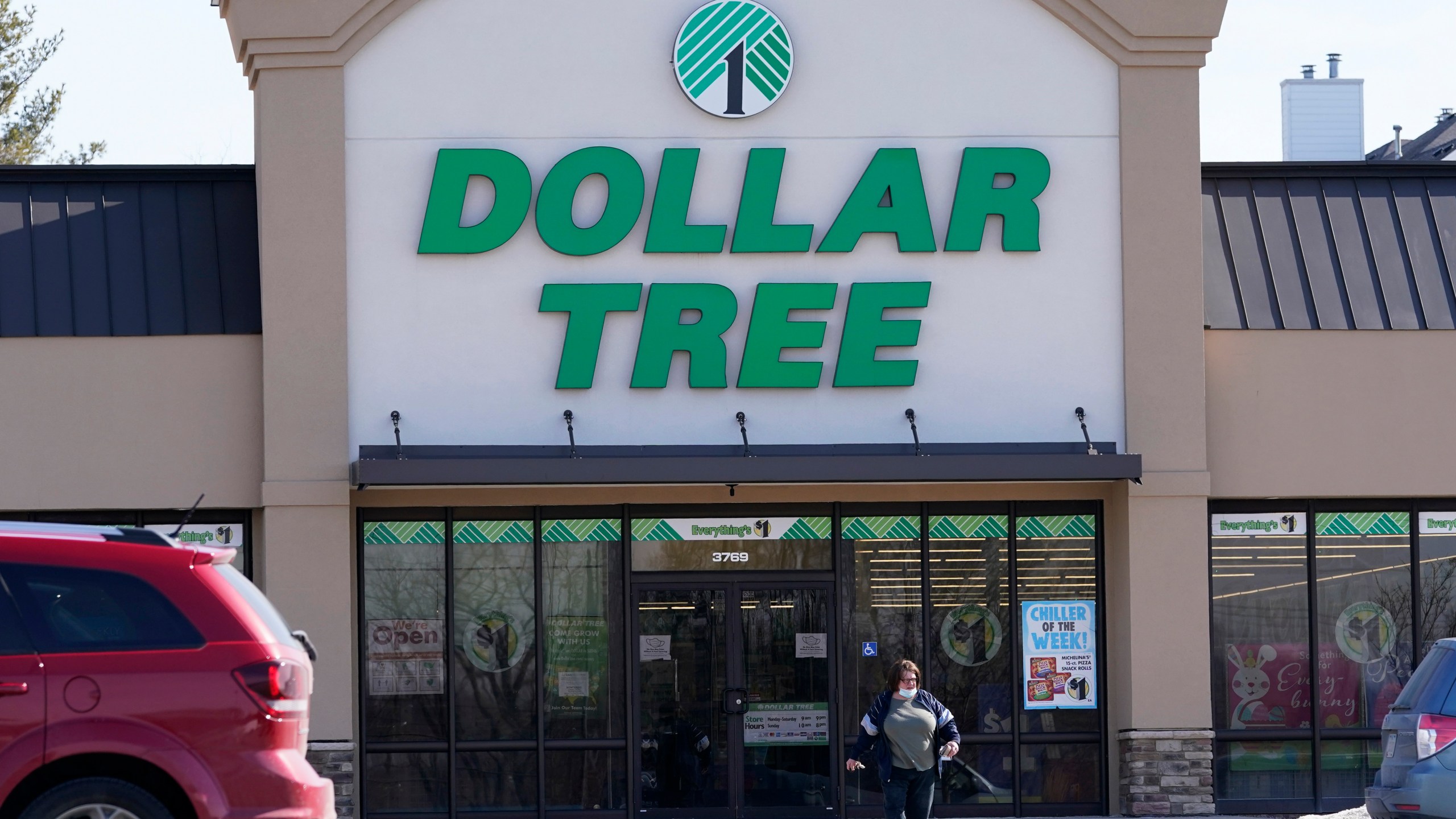 FILE - A woman leaves a Dollar Tree store in Urbandale, Iowa, on Feb. 25, 2021. (AP Photo/Charlie Neibergall, file)