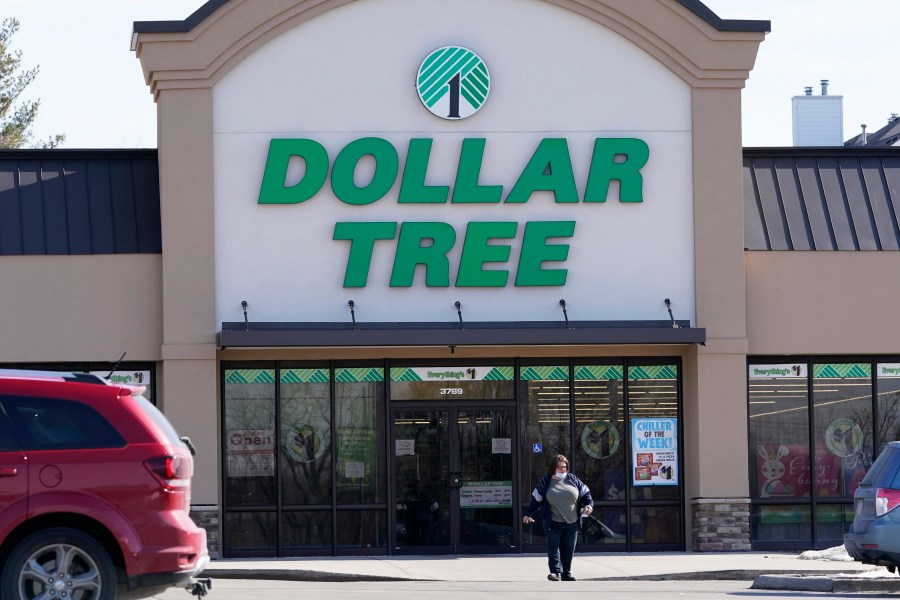 FILE - A woman leaves a Dollar Tree store in Urbandale, Iowa, on Feb. 25, 2021. (AP Photo/Charlie Neibergall, file)