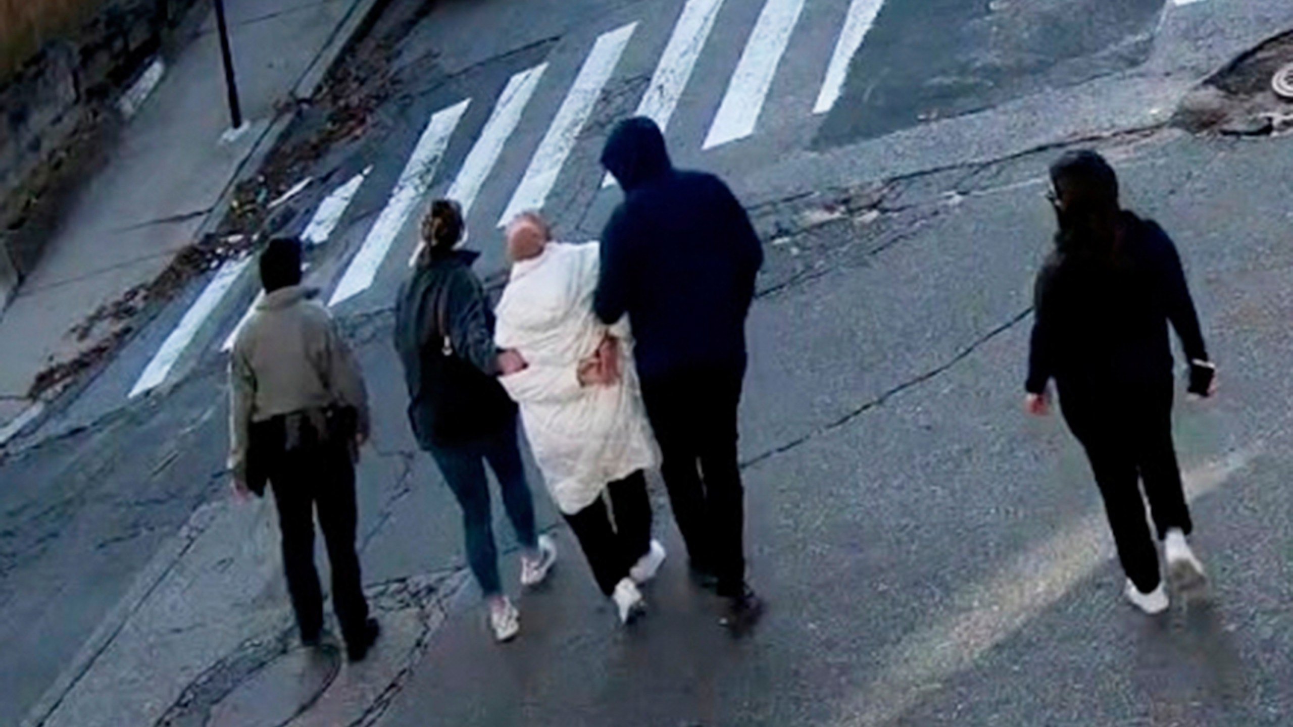 In this image taken from security camera video, Rumeysa Ozturk, a 30-year-old doctoral student at Tufts University, is detained by Department of Homeland Security agents on a street in Sommerville, Mass., Tuesday, March 26, 2025. (AP Photo)